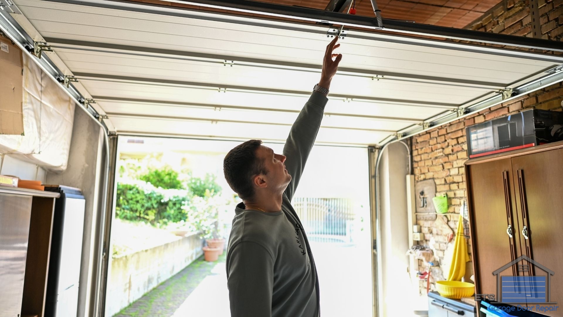 The Hidden Costs of DIY Garage Door Repairs Gone Wrong - DIY vs. Professional Repair: When to Call ETS Garage Door